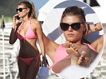 Watch out Miranda and Candice! Beautiful Belarusian Victoria's Secret model Maryna Linchuk displays her enviable figure in a hot pink bikini