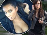 Kim Kardashian bares her cleavage in sexy Twitter snap after gym session... but doesn't look like she worked up much of a sweat