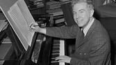 Pulitzer Prize winning composer Elliott Carter poses at the piano in his New York City apartment