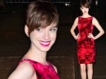 Pretty as a petal! Porcelain doll Anne Hathaway stands out in red floral dress... after interview with Les Miserables co-stars
