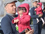 Let me help, Daddy! Billy Zane's cute daughter Eva helps him pick out ornaments for the Christmas tree
