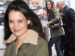 Best foot forward! Katie Holmes puts on brave face in New York downpour... with play's end only a week away
