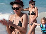 Ashlee Simpson shows off her toned bikini body as she plays with son Bronx in the surf 