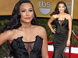 Glee star Naya Rivera turns heads in a daring low-cut gown for her red carpet entrance at the SAG Awards