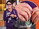 Something you want to tell us? Kris Jenner steps out without her wedding ring as she shops in 'love' tracksuit