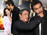 A kiss to the head! Tough guy Jason Momoa play fights with Sylvester Stallone before giving his beautiful co-star an affection peck at film premiere