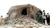 A still from a video shows Islamist militants destroying an ancient shrine in Timbuktu on July 1, 2012. Islamist rebels in northern Mali smashed four more tombs of ancient Muslim saints in Timbuktu on July 1.