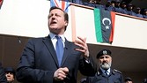 UK Prime Minister David Cameron meets recruits at a police training college in Tripoli, Libya