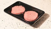 Horse meat found in beef products...General view of two beef burgers. PRESS ASSOCIATION Photo. Picture date: Wednesday January 16, 2013.The Food Safety Authority of Ireland found low levels of horse in beef products sold in LIDL, Aldi, Tesco and Iceland. puknews