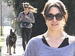 Working up a sweat! Nikki Reed hits the sidewalk running... with her big furry fella in Los Angeles