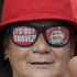 A supporter of Venezuela's President Hugo Chavez wears glasses that reads in Spanish "I am Chavez" while attending a demonstration commemorating the anniversary of a failed coup attempt led by Chavez in 1992, in Caracas, Venezuela, Monday, Feb. 4, 2013. The president was absent for the first time from the annual demonstrations as crowds gathered for multiple marches wearing the red T-shirts of his socialist movement. Chavez remained in Cuba, where he has been out of sight and hasn't spoken publicly since he underwent cancer surgery on Dec. 11. (AP Photo/Ariana Cubillos)