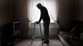 OLD AGED MAN HOLDING ONTO TO WALKING AID RE CARE HOMES OLD AGE ILLNESS PENSIONERS RETIREMENT NURSING HOMES CARERS OAPS OAP UK