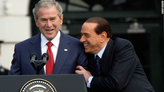 Former President George W. Bush and Berlusconi share a moment during a South Lawn arrival ceremony at the White House on October 13, 2008.