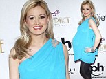 Holly Madison wore an off shoulder baby blue dress with black tights and silver high heels