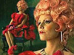 Lady in red! Elizabeth Banks dons bold new look in first sneak peak at The Hunger Games: Catching Fire