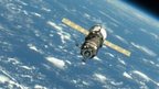 An unpiloted ISS Progress resupply vehicle approaches the International Space Station