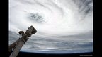 Eye of the Storm - Tropical Cyclone Haruna, over Madagascar, with Canadarm2 pointing at the eye