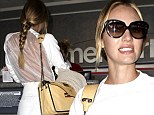 No need for a body scan, then! Candice Swanepoel brings sexy back in see-through white top as she stalks through airport