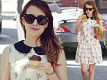 That's rare treat! Skinny Emma Roberts poses with a cupcake in a pretty vintage frock