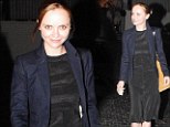 Keeping it simple: Newly engaged Christina Ricci looks chic in a sleek black dress and lace up boots for a dinner date