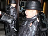 Under wraps! Madonna overdoes it with the layers as she steps out in rag tag outfit of scarves and leather hat