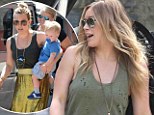 Hole-y moly! Hilary Duff goes grungy in a tattered top just one day after rocking a glamorous look