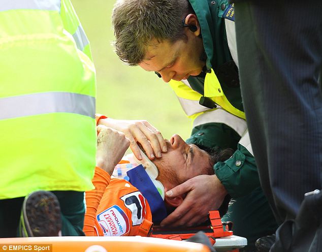 Out of it: Blackpool's Barry Ferguson was kicked in the head by a team-mate