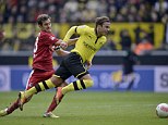Watch this space: Dortmund prospect Mario Goetze (right) has said he would be interested in joining Manchester United but admitted it could be some time away