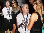 Getting some much needed tips? Paris Hilton meets 'oldest DJ in the world' Ziggy 420 as she attends Ultra Music Festival 