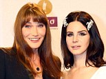 Carla Bruni puts on a brave face during a performance at the Echo Music Awards as her husband Sarkozy is charged with taking financial advantage of L'Oreal heiress