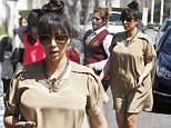 Finally, a maternity dress! Kim Kardashian displays a hint of baby bump as she steps out in billowing smock and sensible sandals 