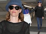 Hat looks nice! Elizabeth Banks hides her locks under a cornflower blue cloche as she jets out of Los Angeles 