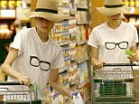 Dowdy Diane Kruger covers her make-up free face with a floppy hat grocery shopping at Gelson's