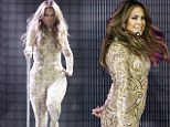 Bet that was tricky to get into! Jennifer Lopez displays her famous curves in an extremely tight glittering jumpsuit 