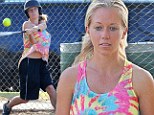 From Playboy to tomboy! Kendra Wilkinson takes a swing at softball game in tie-dye shirt and jersey shorts