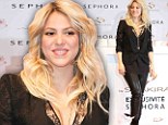 Her hips don't lie! Shakira shows off major cleavage and post-baby curves in leather trousers...less than TWO months after giving birth