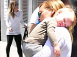 Just couldn't keep his eyes open! Hilary Duff hoists sleeping son after he nods off during shopping trip