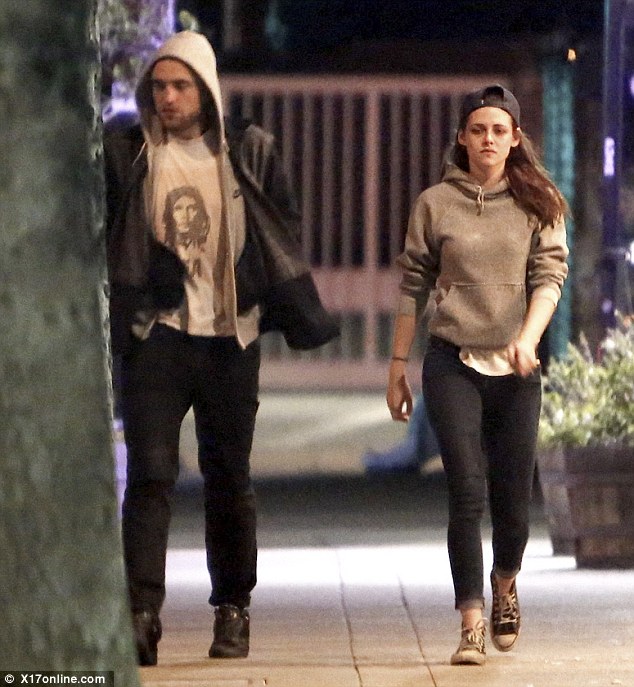 Can't crack a smile? Despite spending their evening close together, both stars looked a little glum during their walk