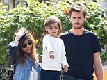 A united front: Kourtney Kardashian and Scott Disick looked every inch the happy family as they stepped out with son Mason on Thursday for the first time since explosive claims surrounding the paternity of the three-year-old tot broke 