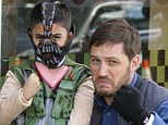Bane buddies: Actor Tom Hardy poses Tuesday with a boy dressed as his evil character Bane from The Dark Knight Rises, the final film in the Batman trilogy by director Christopher Nolan
