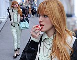 Bella Thorne, star of Disney's Shake It Up wears a teal pantsuit as she gets to business in New York City