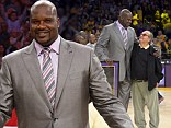 Former Los Angeles Lakers center Shaquille O'Neal stands with actor Jack Nicholson after they retired his jersey during the half of the Lakers' NBA basketball game against the Dallas Mavericks
