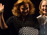 Fashion star: Diane von Furstenberg debuted a snazzy custom-made arm sling as she stepped up to the stage with Hillary Clinton (right) at the 2013 Vital Voices Global Awards