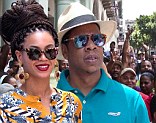 Police are called to keep Beyonce and Jay-Z safe in Cuba as they are mobbed by fans while eating in Havana 