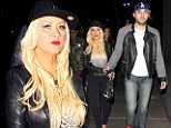 A very tight squeeze! Christina Aguilera shows off her bumper curves in black jeans during Rihanna show outing with boyfriend