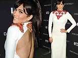 Baby got back! Paula Patton attends the New York screening of her film Disconnect in a skin-baring white dress