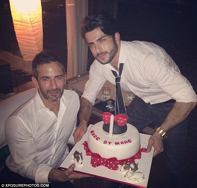 Save a slice for us: Marc and Harry pose with a special birthday cake, complete with dogs made out of icing 