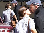 Jennifer Garner and Ben Affleck steal a kiss outside of their daughter's school in Los Angeles on Wednesday