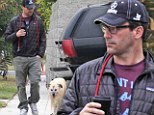 Mad Men star Jon Hamm takes his adopted dog Cora out for a walk on Saturday in the Los Feliz area of Los Angeles