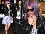 Family troubles aside: Kelly Osbourne puts on brave front as she jets to Sydney with fiance Matthew Mosshart 